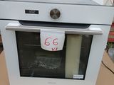 a white oven sitting on top of a cardboard box