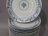 many plates stacked on top of each other on a table