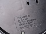 a close up of a metal object with a label on it