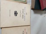 several books are stacked on top of each other on a table