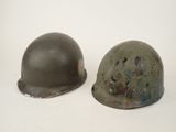 pair of wwii era german steel helmet helmets