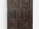 an old wooden door with many squares and squares on it