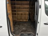 a white van with a wooden door and shelves in the back