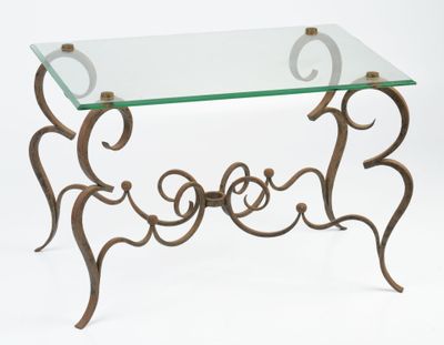 a glass table with a metal frame and a glass top