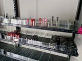 a lot of lipstick on the shelves in the store