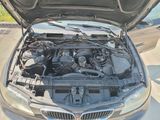 a car with its hood open and the engine in the trunk