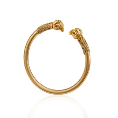an image of a gold ring with a snake head on it