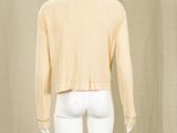 an image of a mannequin wearing a yellow shirt and white pants