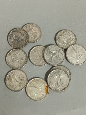 a lot of coins that are sitting on a table