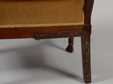an image of a chair with a brown upholstered seat and a wooden frame