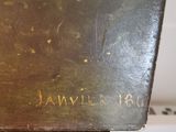 a brown box with writing on it sitting on a table