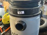 a close up of a vacuum on a table in a warehouse