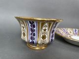 pair of purple and white porcelain bowls with gold rims