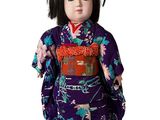 an image of a doll of a woman wearing a purple kimono