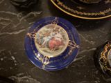 a plate with a picture on it sitting on a table