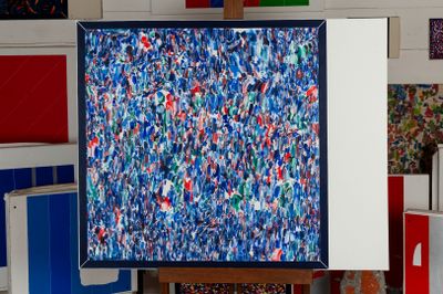 a picture of a painting on a easel in a room
