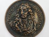l'image d'une pièce de monnaie sur laquelle figure le visage d'un homme