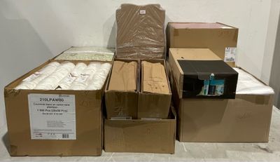 several boxes of toilet paper are stacked on top of each other