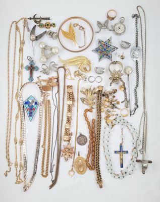 a group of various necklaces and bracelets on a white surface