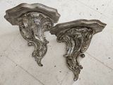 pair of antique wall brackets in the shape of an octopus