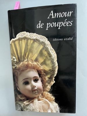 a book with a picture of a doll on it