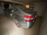 an image of a car in a garage with the door open