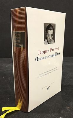 a book with a picture of a man on it and a pair of scissors in front of it