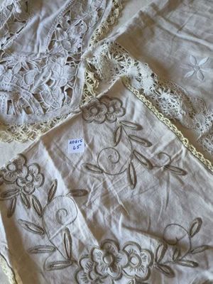 a lot of laces on a bed with a tag on it