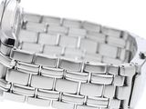 a close up of a watch on a white surface