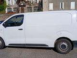 a white van that is parked in the parking lot