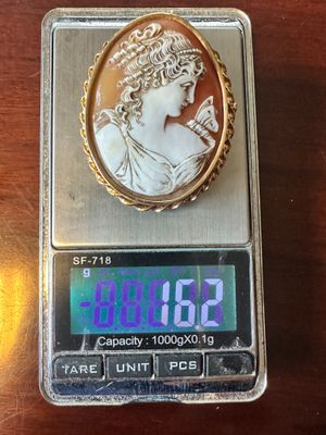 une image représentant une pièce d'or sur laquelle figure une femme