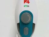 a white and blue steam mop sitting on a table