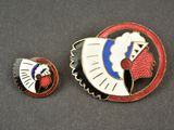 two pins with a red, white, and blue design on them