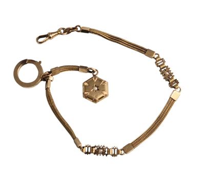 Chaine de montre en or avec breloque sertie d'une perle. - Photo 1