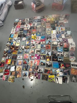 a large collection of dvds on the floor of a room