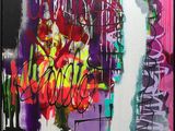 painting of colorful graffiti on a wall in a black frame