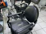 a photo of a barber chair in a room