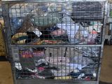 a large metal cart with many items inside of it