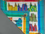 a close up of a multicolored scarf hanging on a wall