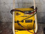 a small yellow machine that is sitting on the ground