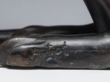 a close up of a bronze statue of a cat