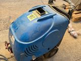 a blue machine that is sitting on the ground