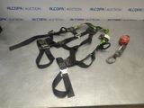 two lanyards and a keychain on a table in front of a sign