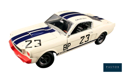 a toy car that is sitting on a white surface