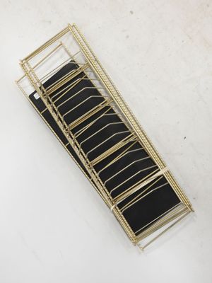 an image of a black and gold stair case on a white surface