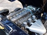 a close up view of a car engine with its hood open