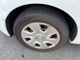 a white car that has a flat tire on it