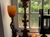 a lamp that is sitting on a window sill next to a lamp