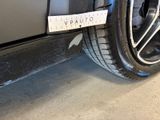 a close up of a car tire with a sticker on it