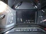 a close up of a car dashboard with a clock on it